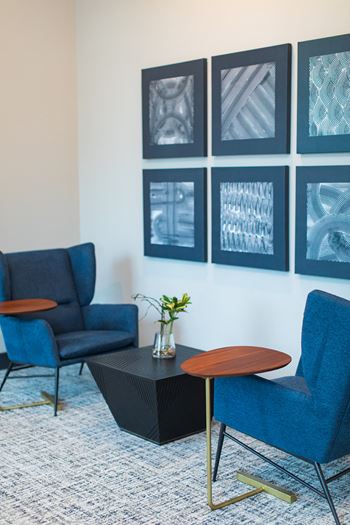 A meeting room with blue chairs